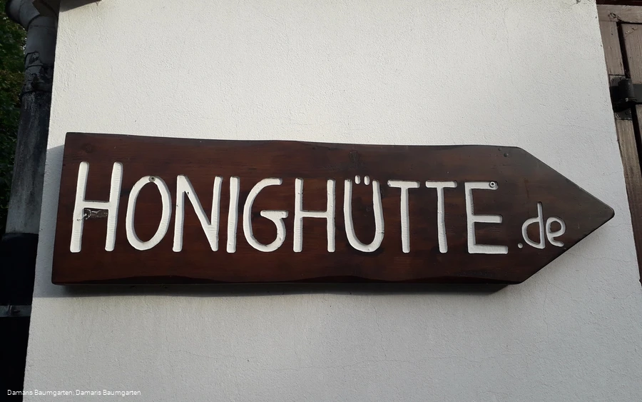Wegweiser zur Honighütte